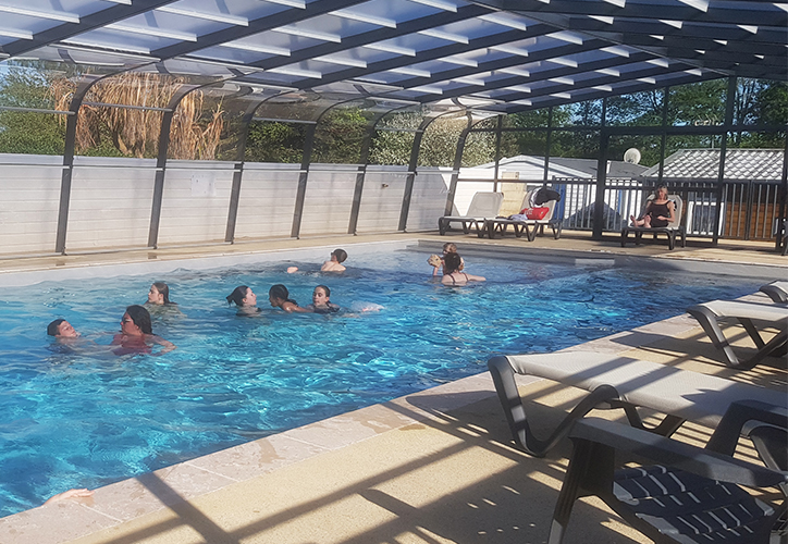 The interior of the heated swimming pool at the Abri de l’Océan campsite in Brittany